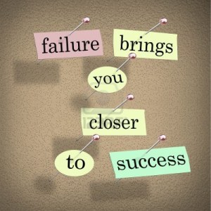 14507871-the-words-failure-brings-you-closer-to-success-on-pieces-of-paper-pinned-to-a-bulletin-board-encoura